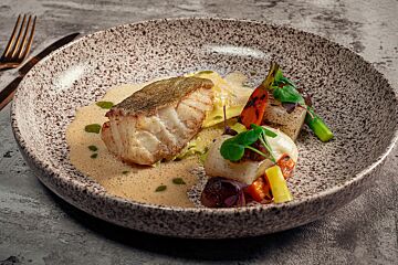 Gebakken kabeljauw met ravioli van scampi